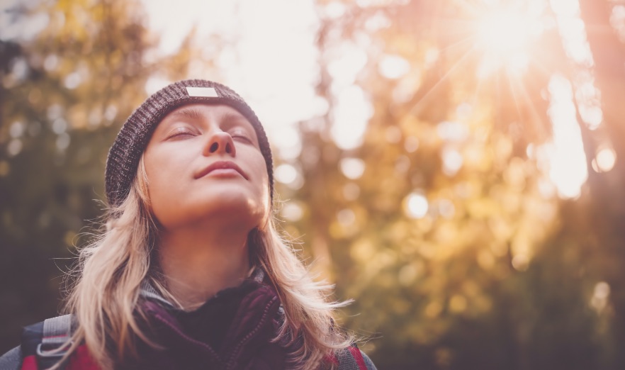 Young woman hiking and going camping in nature